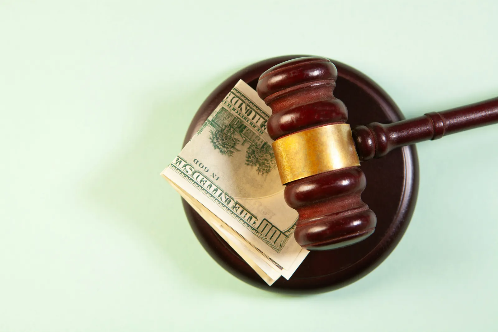 Gavel and money representing financial damages in a personal injury case