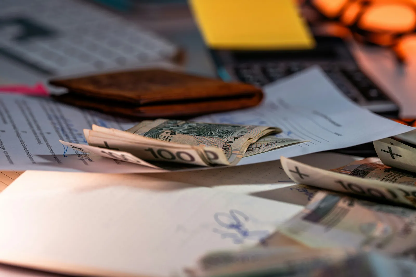 Money and documents on a desk representing insurance claims and compensation