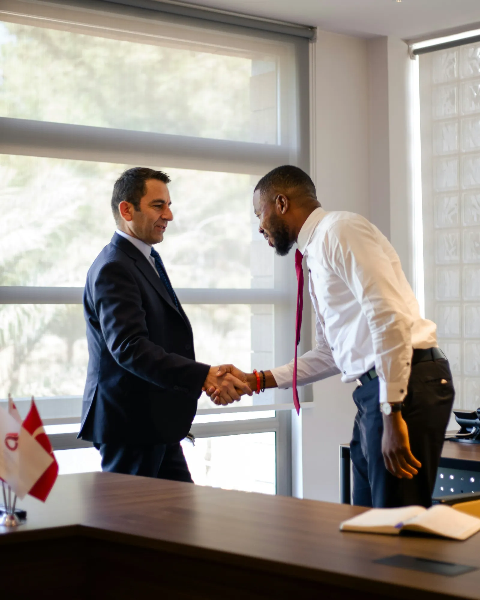 Business handshake representing a negotiated personal injury settlement